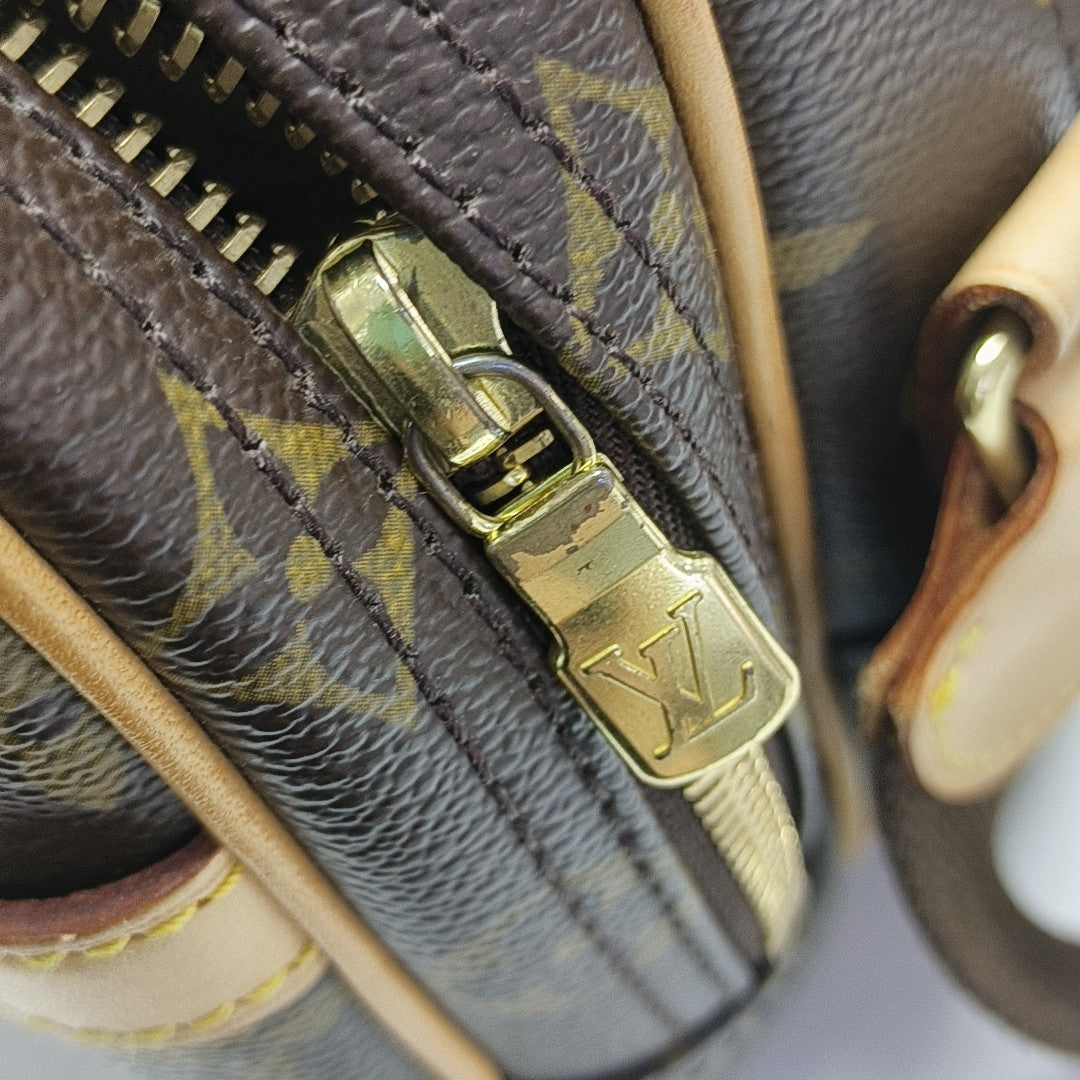 REPORTER PM Monogram Coated Canvas Brown