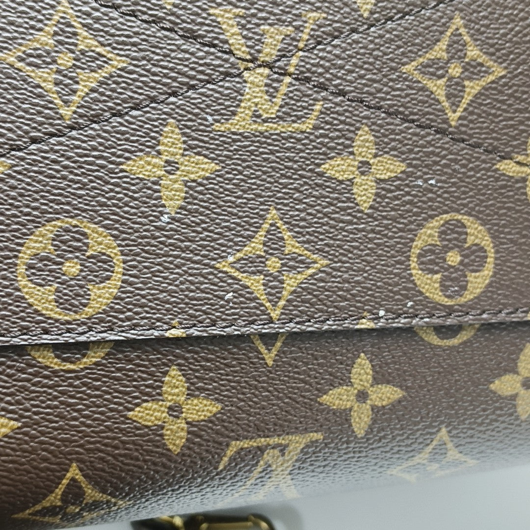 MONTAIGNE GM Monogram Coated Canvas Brown