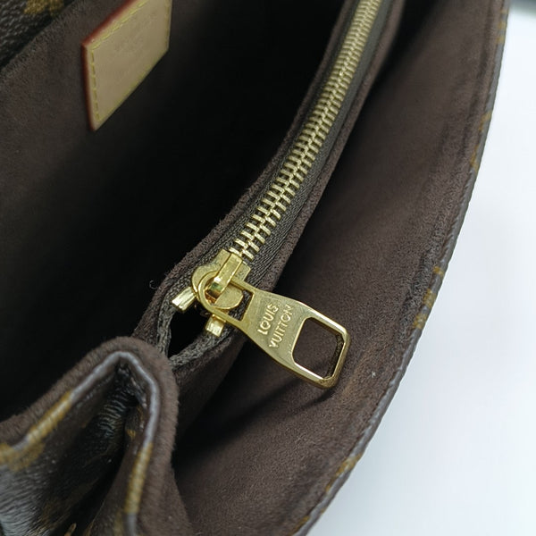 MÉTIS EAST WEST Monogram Coated Canvas Brown