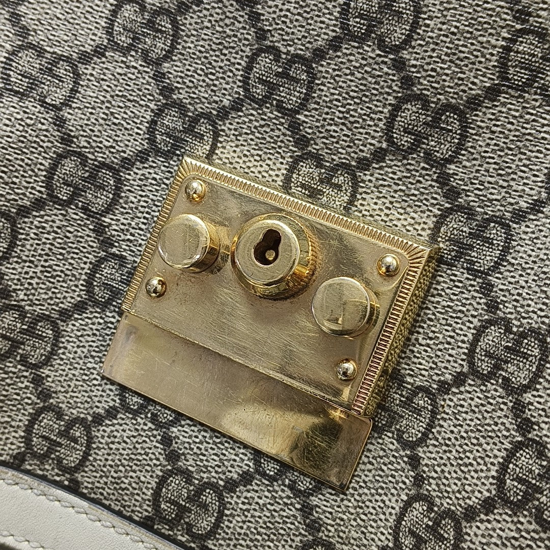 Padlock Small Monogram Coated Canvas Beige