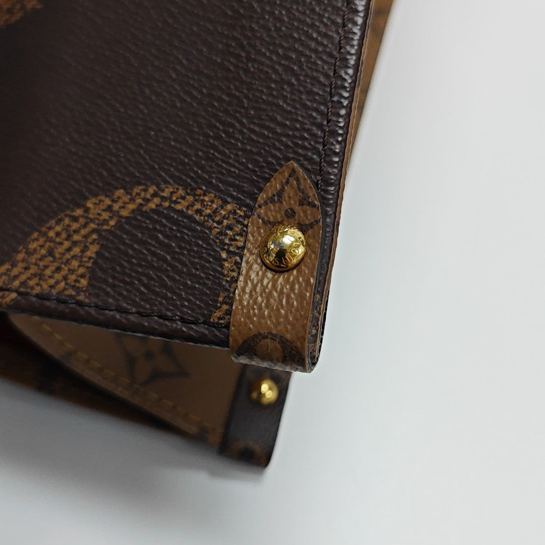 ONTHEGO MM Monogram Coated Canvas Brown