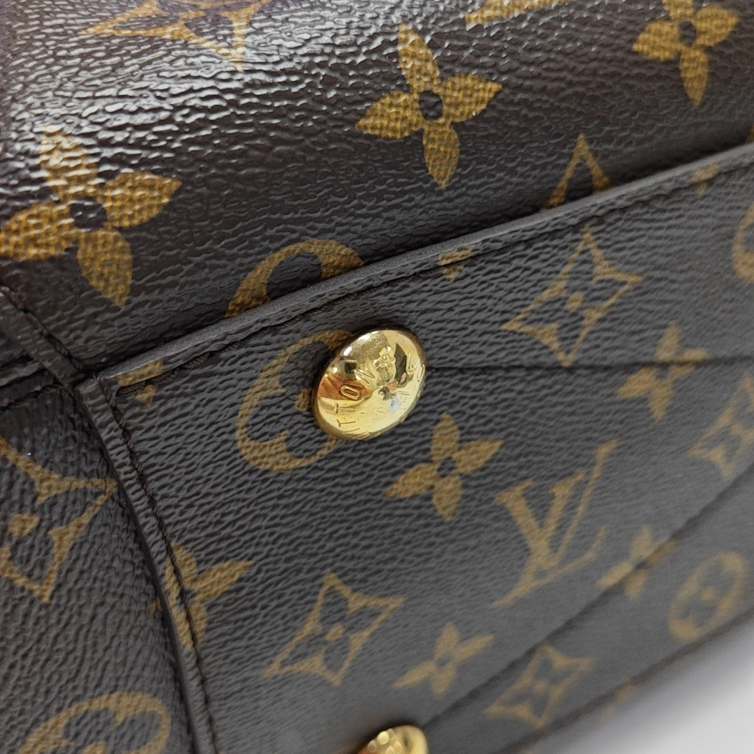 MONTAIGNE GM Monogram Coated Canvas Brown