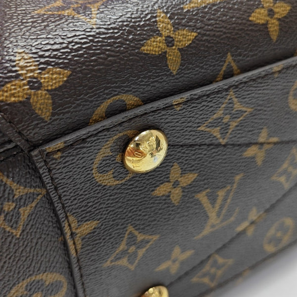 MONTAIGNE GM Monogram Coated Canvas Brown