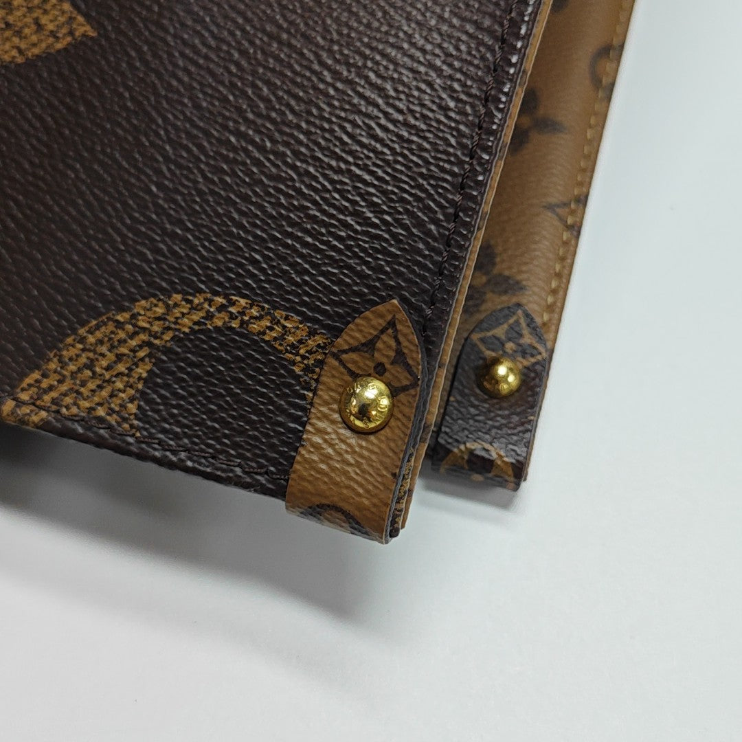 ONTHEGO MM Monogram Coated Canvas Brown