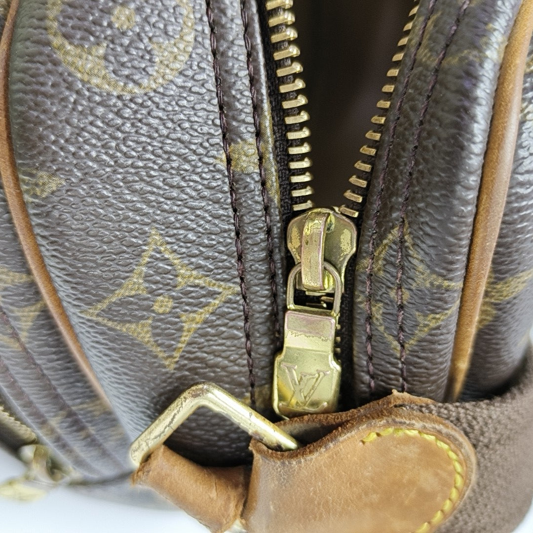 REPORTER PM Monogram Coated Canvas Brown