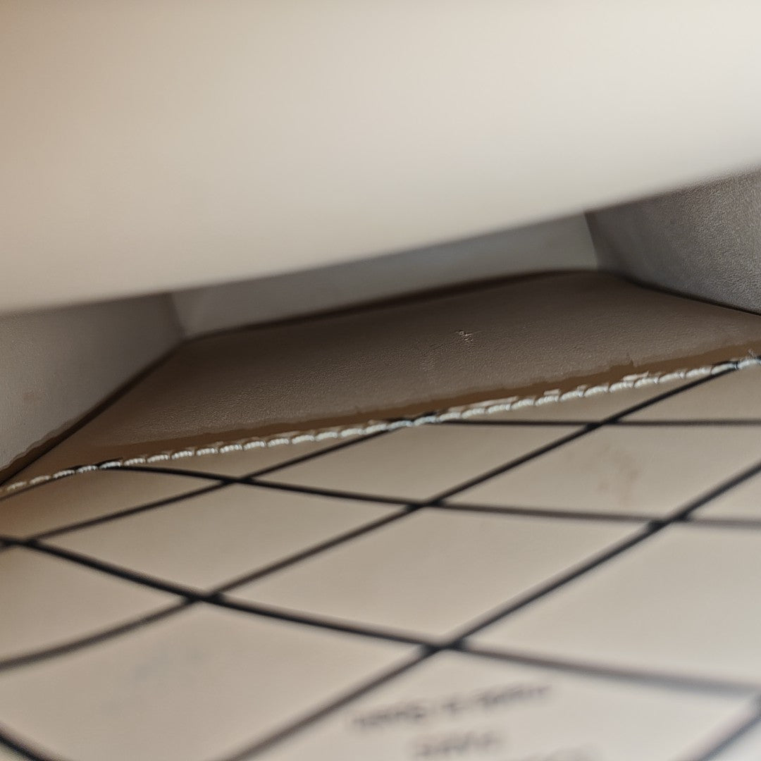 TRUNK Monogram Coated Canvas Brown