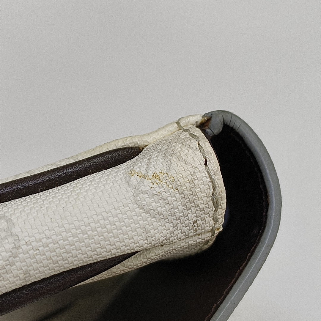 Monogram Coated Canvas Clutch White