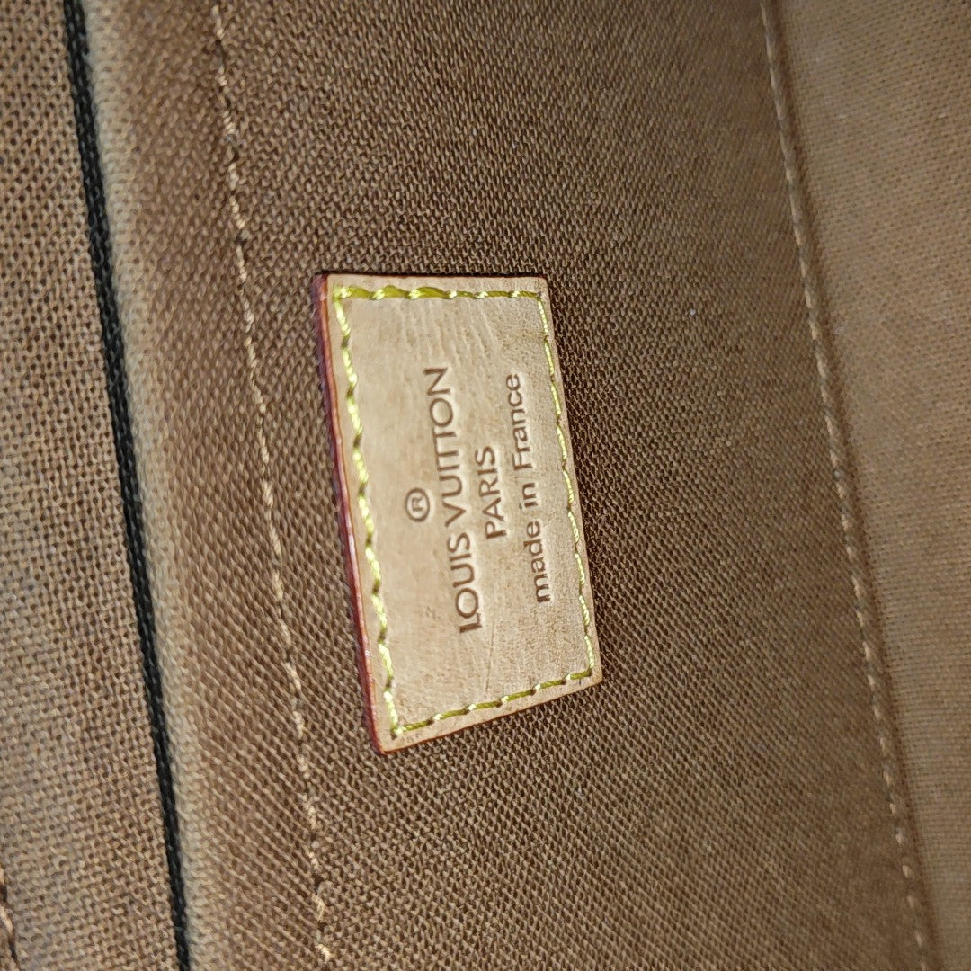 TIKAL Monogram Coated Canvas Brown
