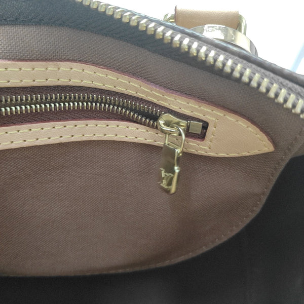 SPEEDY 25 Monogram Coated Canvas Brown