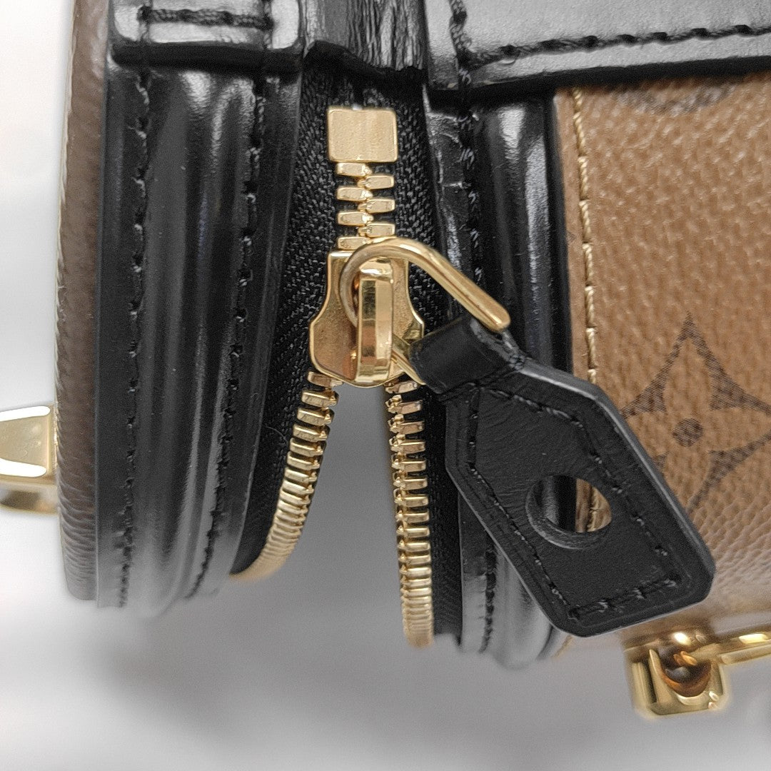 CANNES PM Monogram Coated Canvas Brown
