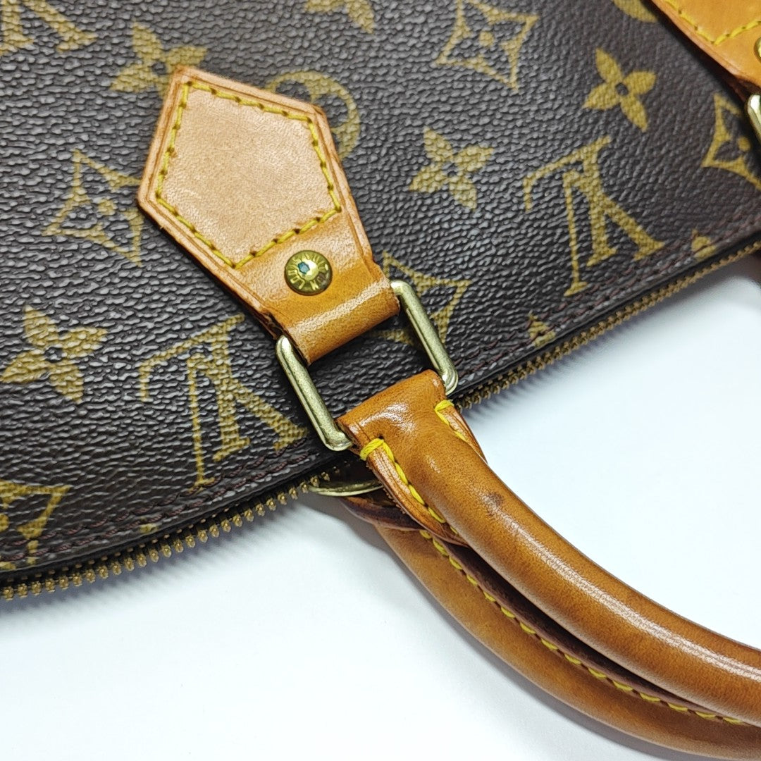 ALMA PM Monogram Coated Canvas Brown