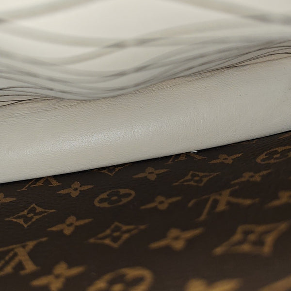 TRUNK Monogram Coated Canvas Brown