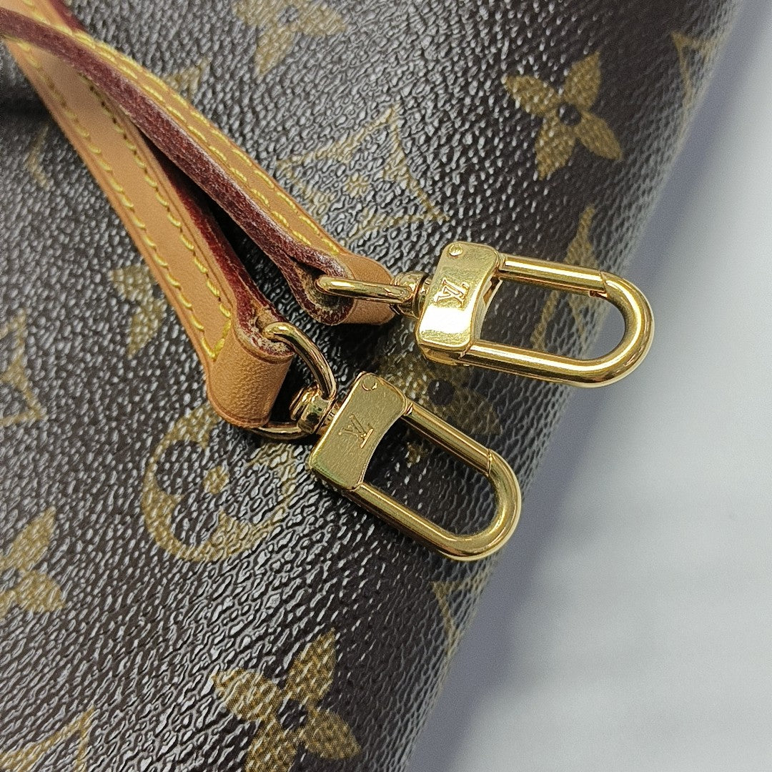 EVA Monogram Coated Canvas Brown
