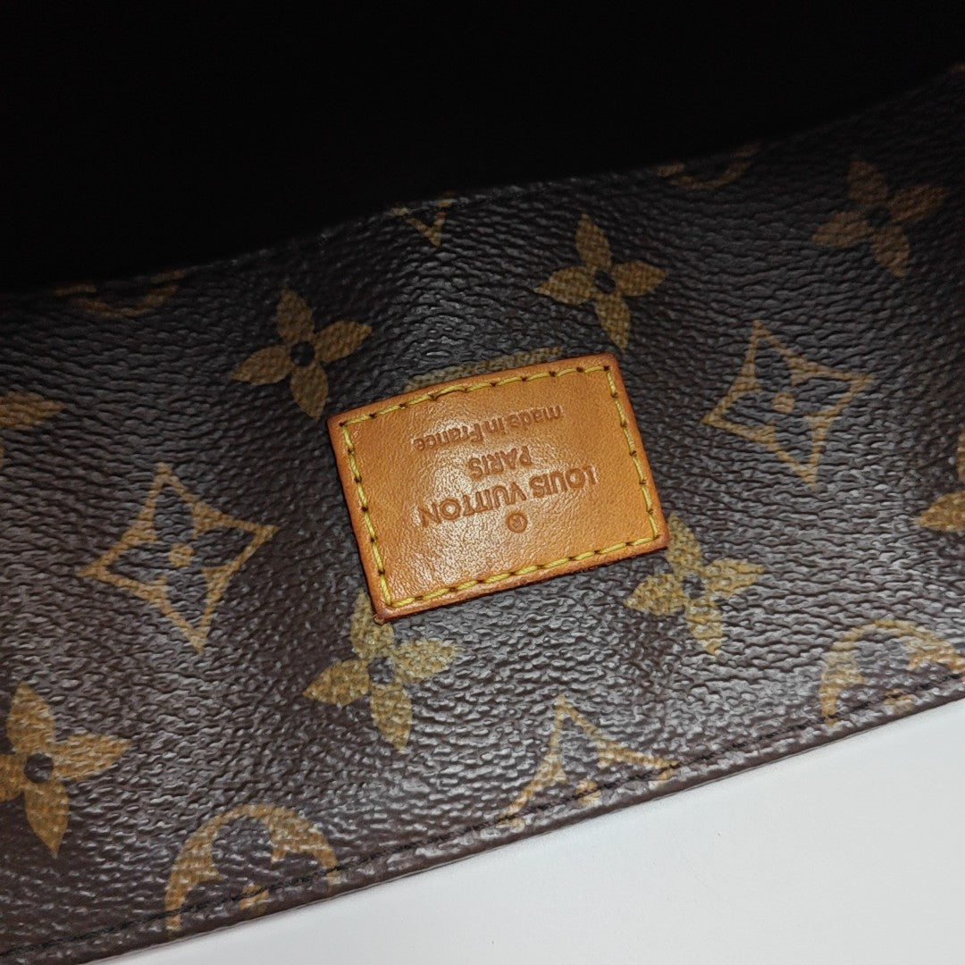 MELIE Monogram Coated Canvas Brown