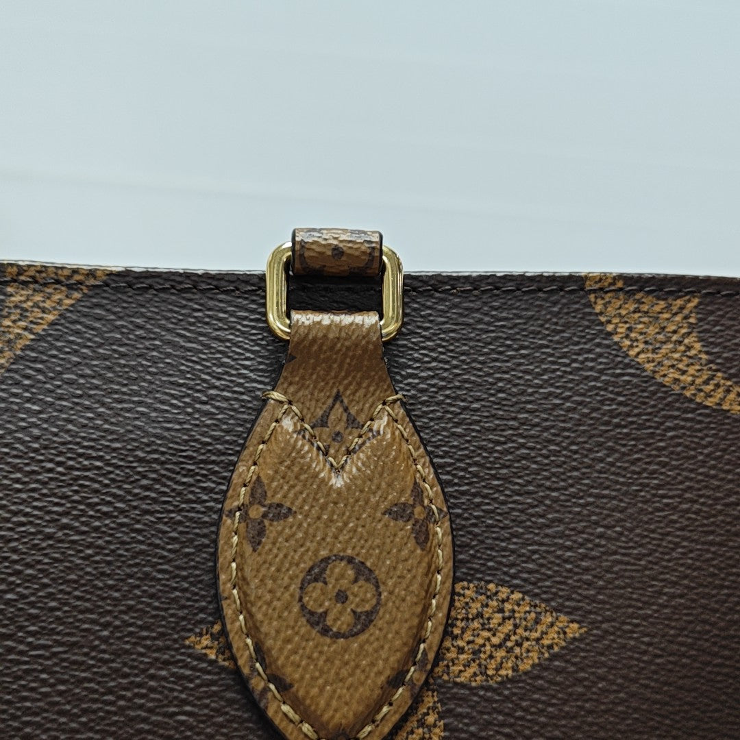 ONTHEGO MM Monogram Coated Canvas Brown