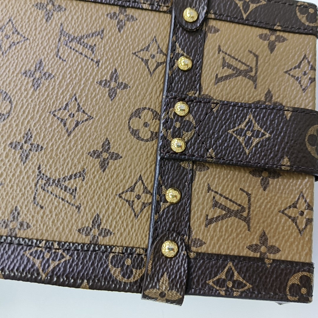 TRUNK Monogram Coated Canvas Brown