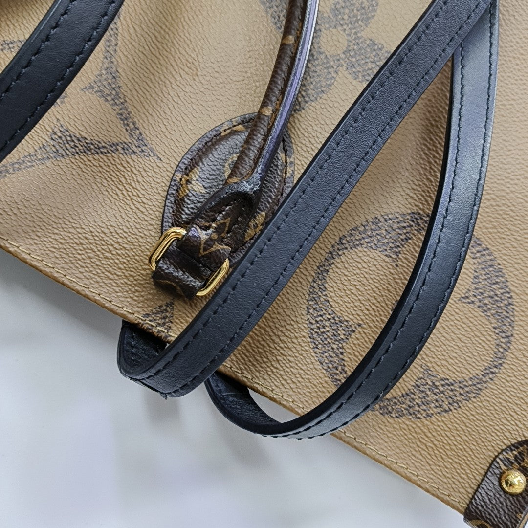 ONTHEGO GM Monogram Coated Canvas Brown