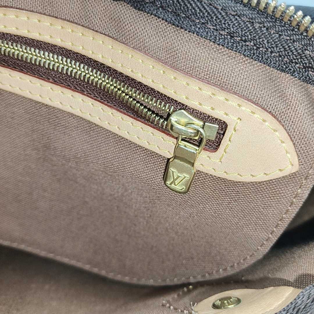 SPEEDY 25 Monogram Coated Canvas Brown