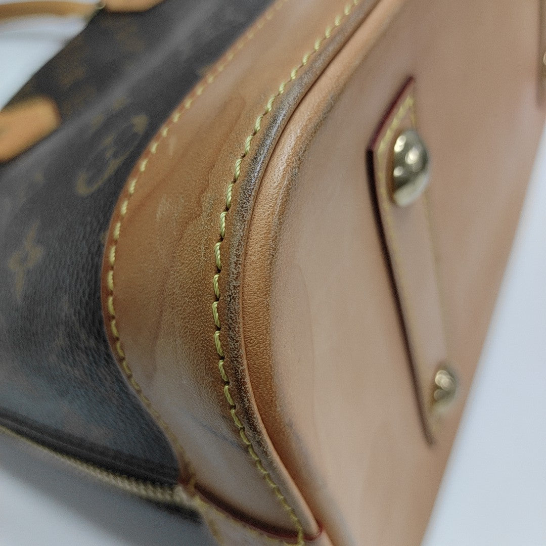 ALMA PM Monogram Coated Canvas Brown