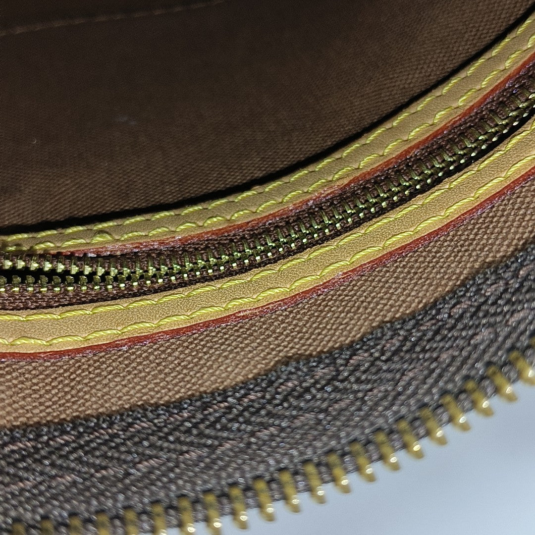 SPEEDY 25 Monogram Coated Canvas Brown