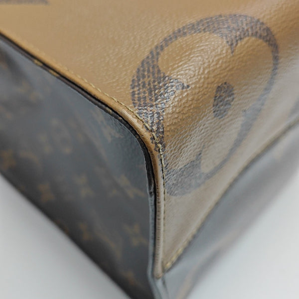 ONTHEGO MM Monogram Coated Canvas Brown