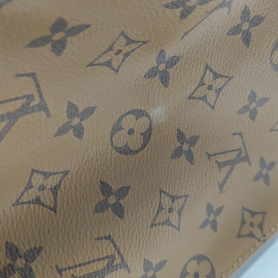 ONTHEGO GM Monogram Coated Canvas Brown