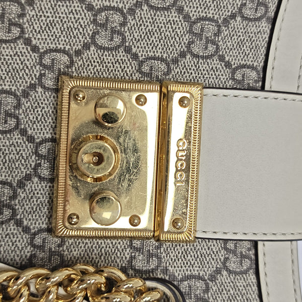 Padlock Small Monogram Coated Canvas Beige
