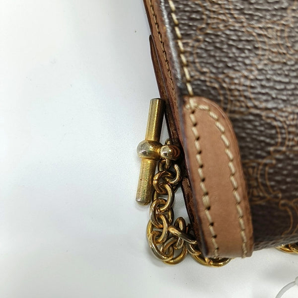 Authenticated pre-owned  MACADAM BLASON TRIOMPHE Coated Canvas Brown - Top Handle Bag at Looply