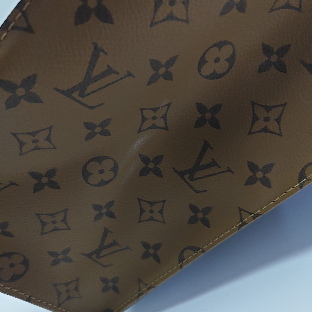 ONTHEGO MM Monogram Coated Canvas Brown