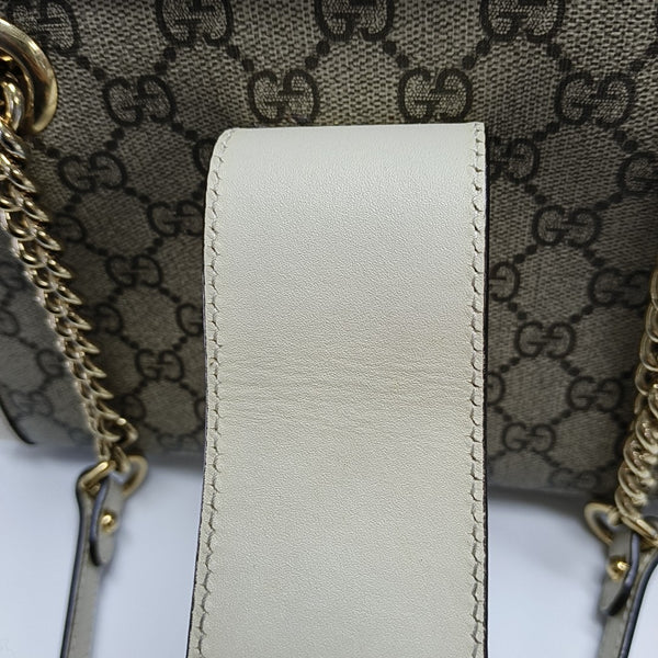 Padlock Small Monogram Coated Canvas Beige