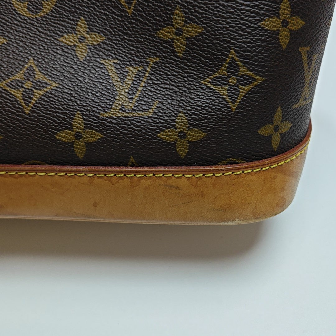 ALMA PM Monogram Coated Canvas Brown