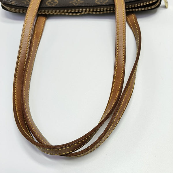 COUSSIN GM Monogram Coated Canvas Brown