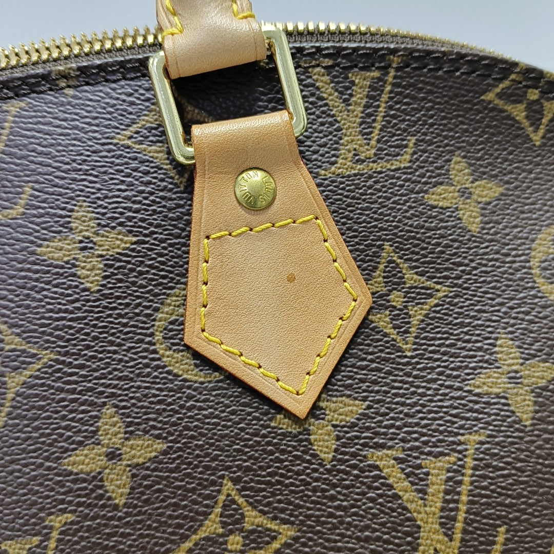 ALMA PM Monogram Coated Canvas Brown