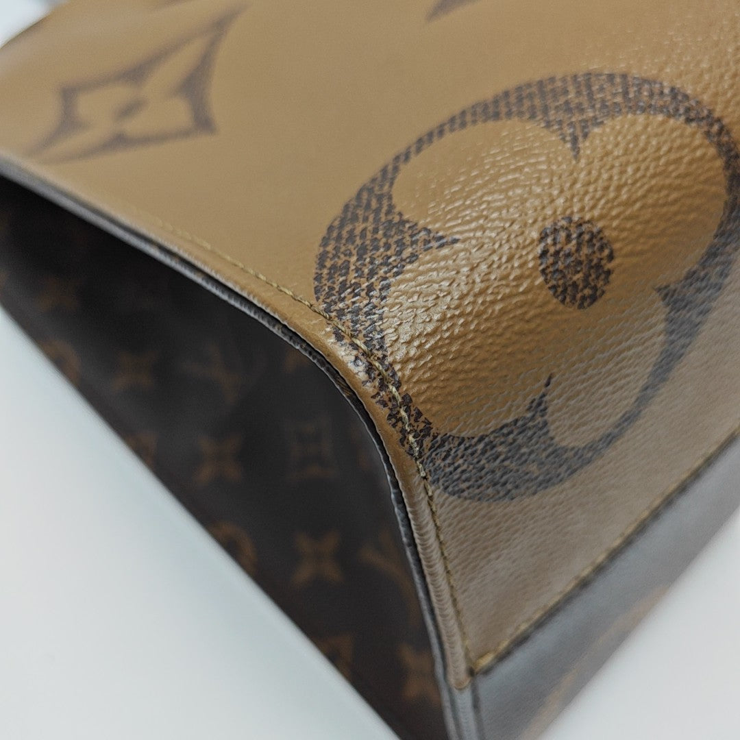ONTHEGO MM Monogram Coated Canvas Brown