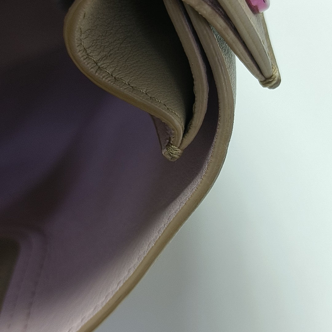 Christian Addict Calfskin Beige