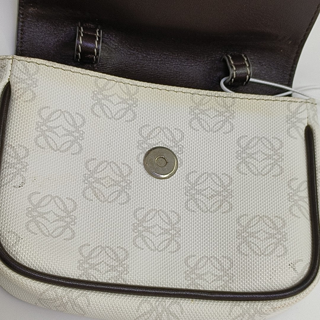 Monogram Coated Canvas Clutch White