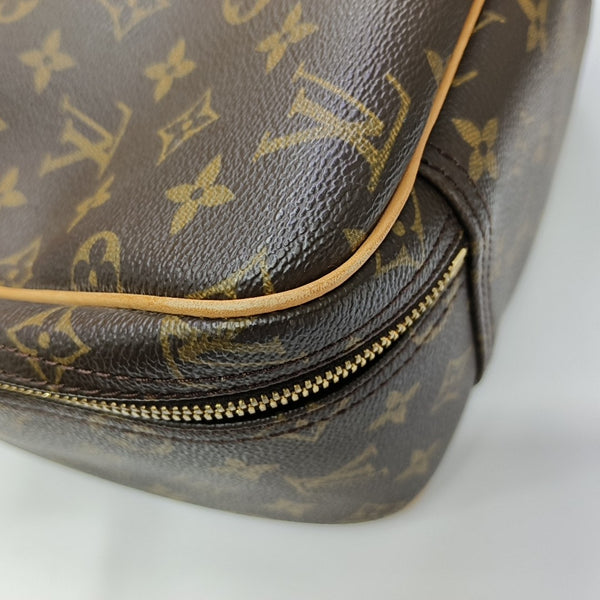 EXCURSION Monogram Coated Canvas Brown