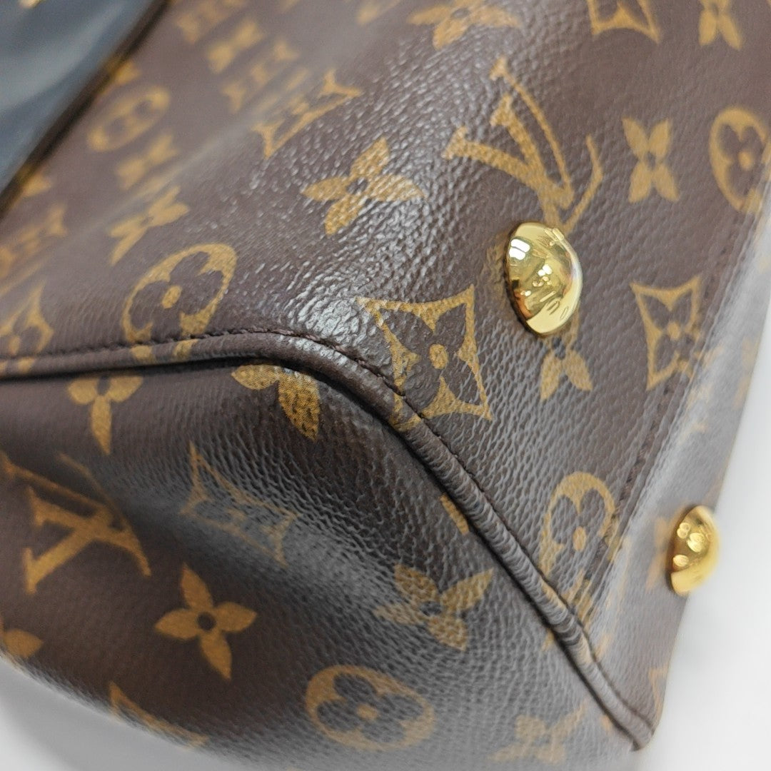 VÉNUS Monogram Coated Canvas Brown