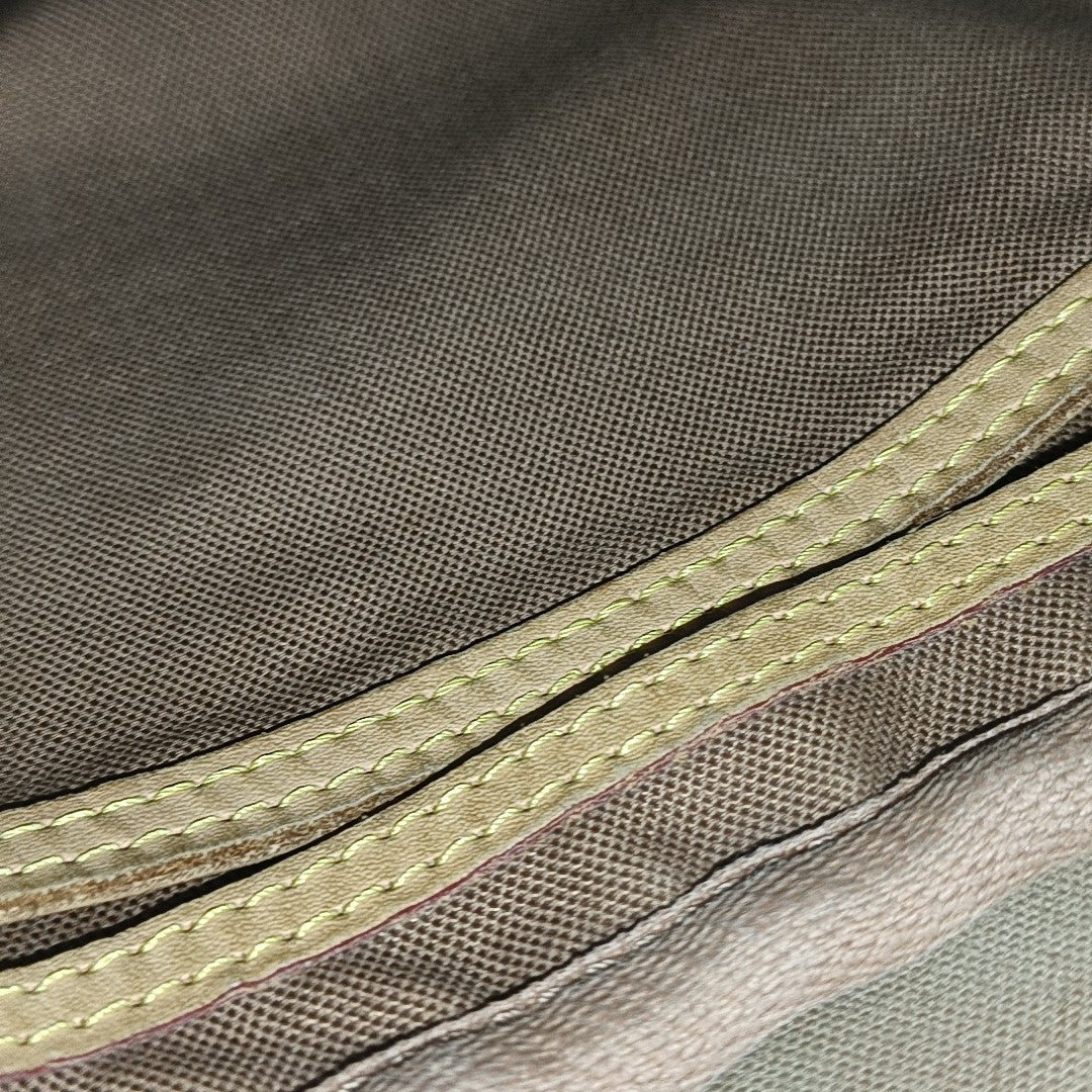MONTORGUEI Monogram Coated Canvas Brown