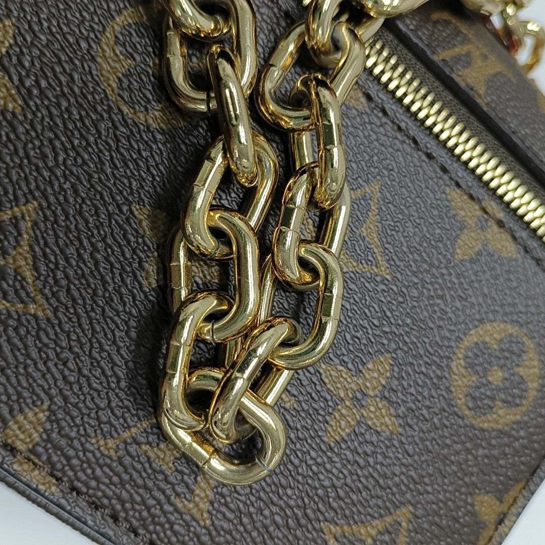 MÉTIS EAST WEST Monogram Coated Canvas Brown