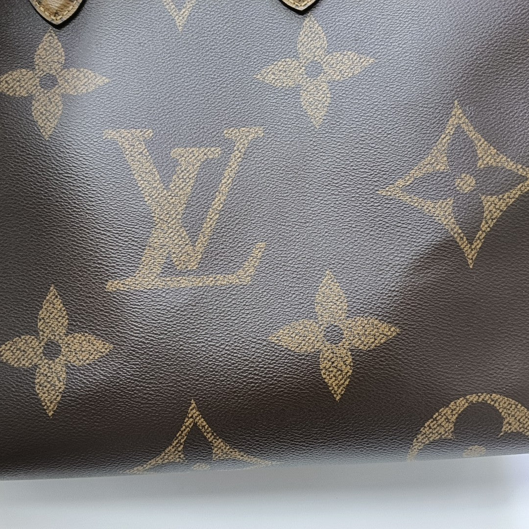 ONTHEGO GM Monogram Coated Canvas Brown