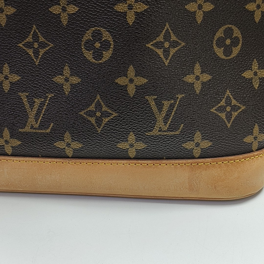 ALMA PM Monogram Coated Canvas Brown