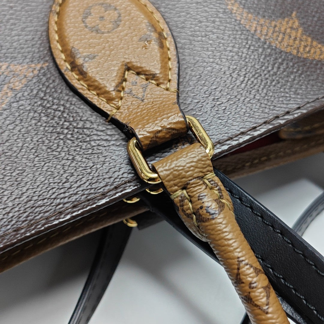 ONTHEGO GM Monogram Coated Canvas Brown