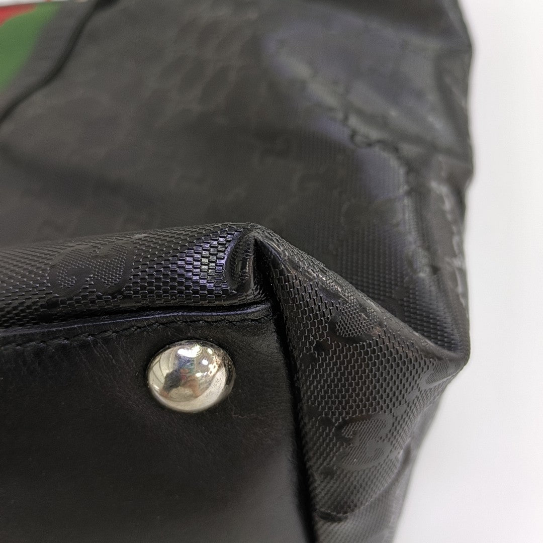 Rania Monogram Coated Canvas Black