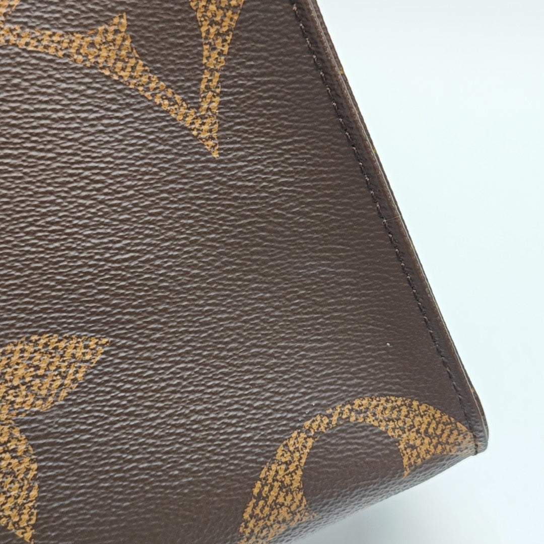 ONTHEGO MM Monogram Coated Canvas Brown