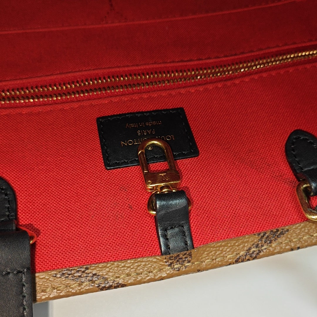 ONTHEGO MM Monogram Coated Canvas Brown