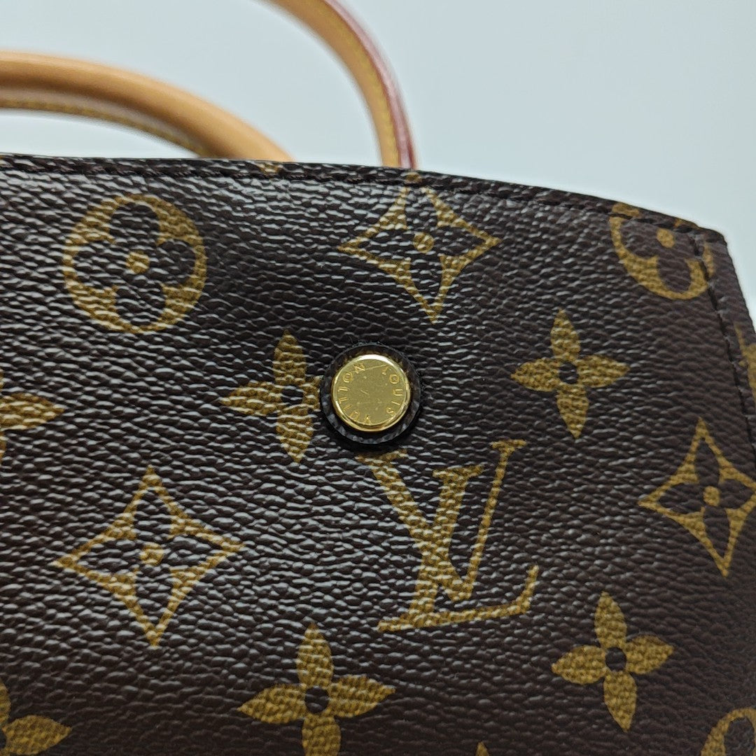MONTAIGNE GM Monogram Coated Canvas Brown