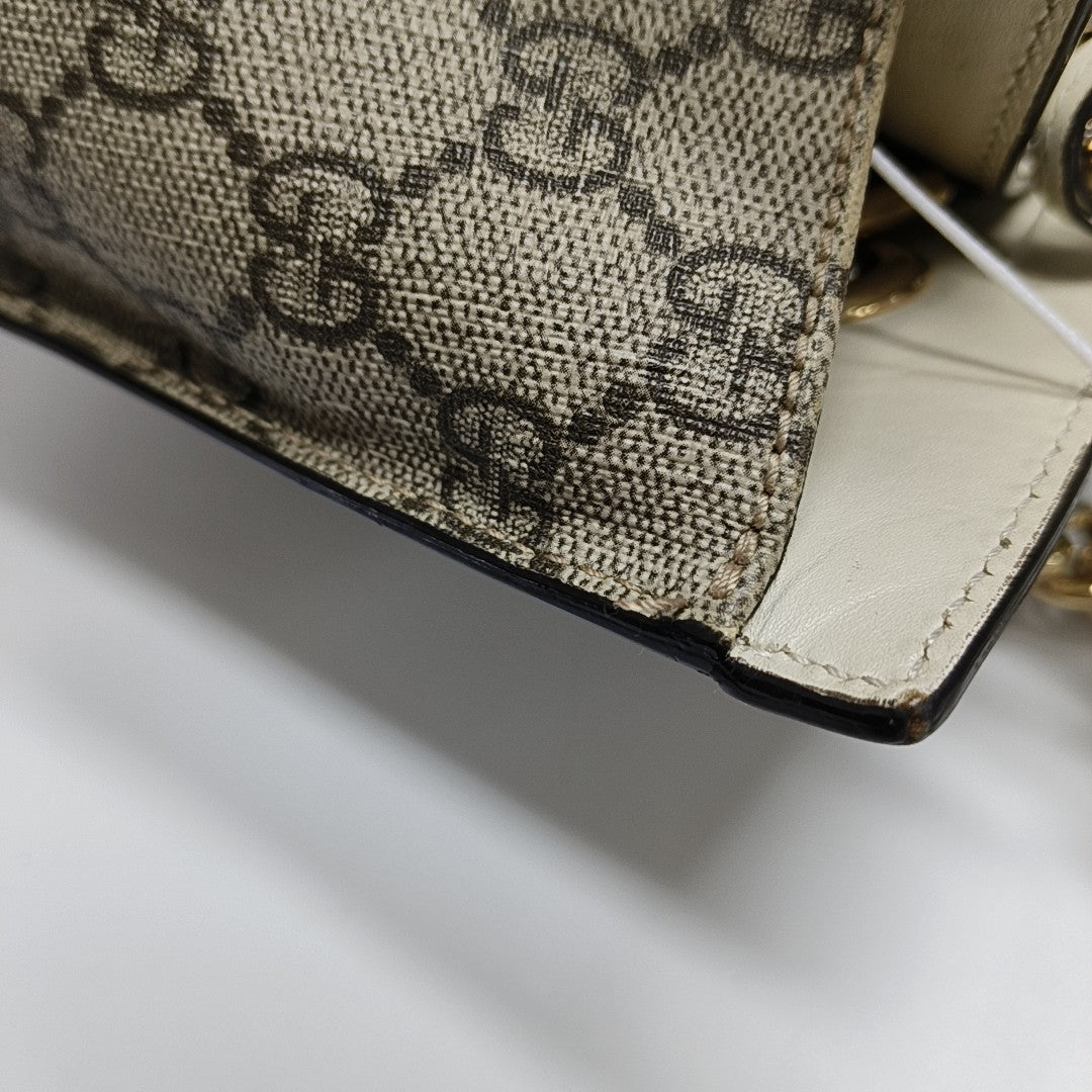 Padlock Small Monogram Coated Canvas Beige