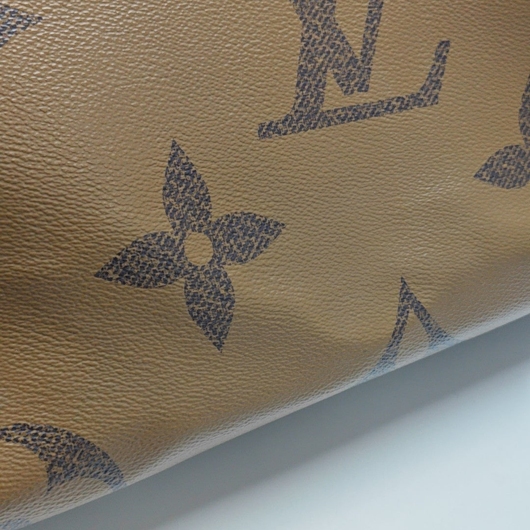 ONTHEGO GM Monogram Coated Canvas Brown