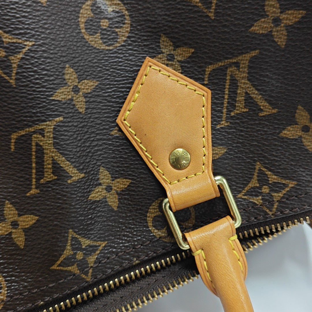 SPEEDY 25 Monogram Coated Canvas Brown